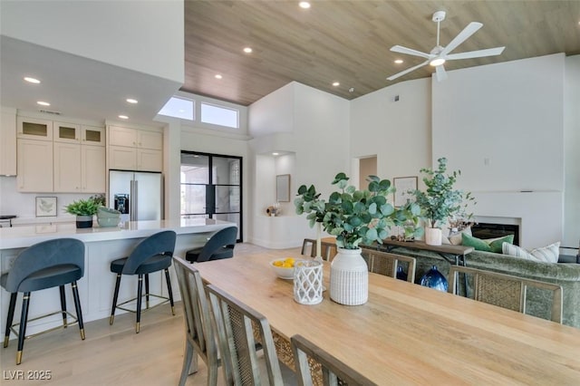 9425 Villa Ridge Dr, Las Vegas, NV 89134 - dining room with light wood-type flooring, recessed lighting, a ceiling fan, wooden ceiling, and a towering ceiling