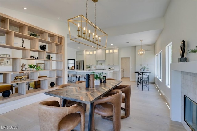 9520 Sundial Dr, Las Vegas, NV 89134 - dining area featuring light wood-style floors and recessed lighting