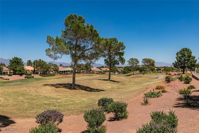 9520 Sundial Dr, Las Vegas, NV 89134 - view of community with golf course view, a residential view, a yard, and a mountain view