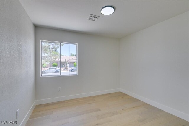 9520 Sundial Dr, Las Vegas, NV 89134 - empty room with light wood-style floors and baseboards