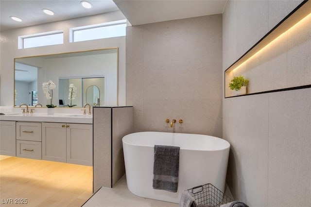 9520 Sundial Dr, Las Vegas, NV 89134 - bathroom featuring double vanity and a freestanding tub