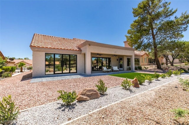 9520 Sundial Dr, Las Vegas, NV 89134 - rear view of house featuring ceiling fan, a tile roof, stucco siding, and a patio area