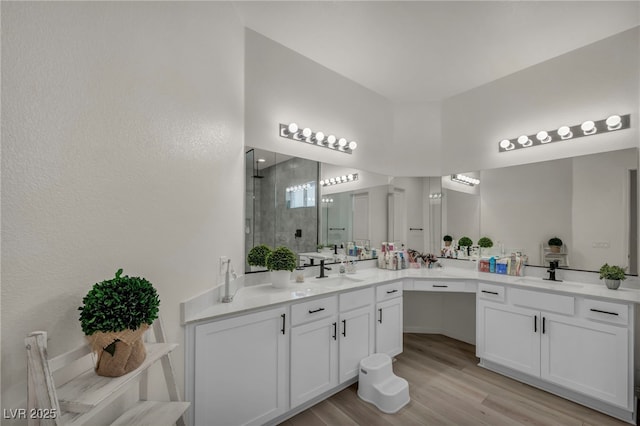 5851 Slate Rock Ct, Las Vegas, NV 89149 - full bathroom with a stall shower, vanity, and wood finished floors