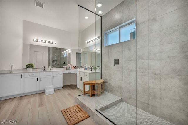 5851 Slate Rock Ct, Las Vegas, NV 89149 - bathroom with walk in shower, double vanity, wood finished floors, and recessed lighting
