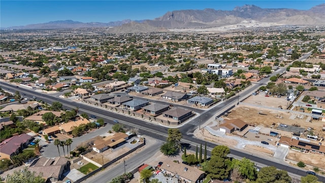 5851 Slate Rock Ct, Las Vegas, NV 89149 - aerial view of property and surrounding area featuring mountains and nearby suburban area
