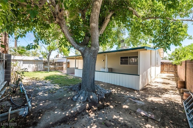 1904 Fontenelle St, Las Vegas, NV 89102 - back of house with a fenced backyard and a patio area