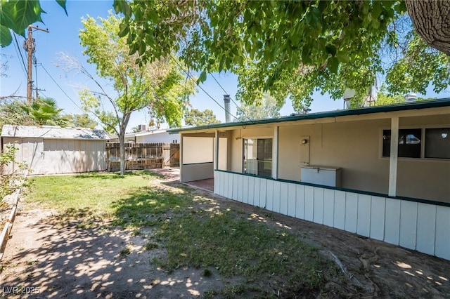 1904 Fontenelle St, Las Vegas, NV 89102 - back of house featuring stucco siding and a chimney