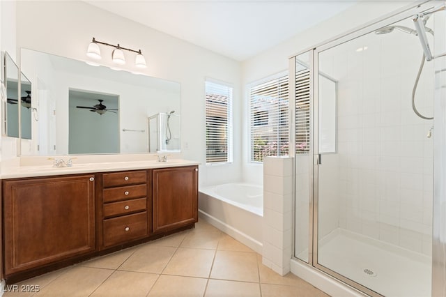 11900 Calle De Sol Dr, Las Vegas, NV 89138 - bathroom featuring a stall shower, a garden tub, tile patterned flooring, double vanity, and ceiling fan