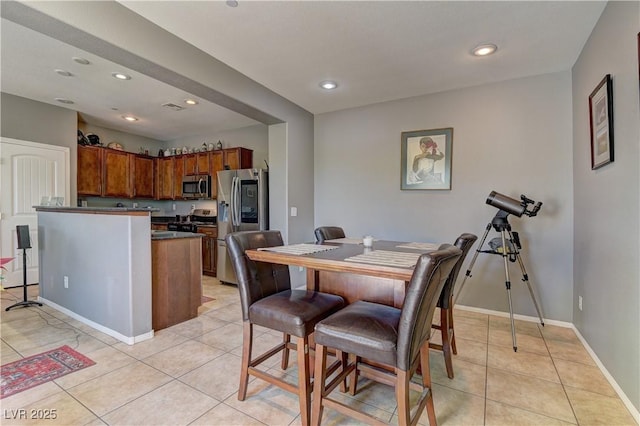 1904 Via Firenze, Henderson, NV 89044 - dining room with light tile patterned floors and recessed lighting