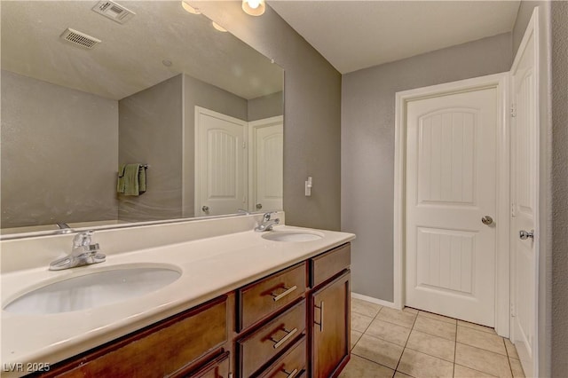 1904 Via Firenze, Henderson, NV 89044 - bathroom featuring double vanity and tile patterned floors