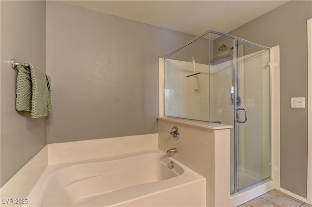 1904 Via Firenze, Henderson, NV 89044 - bathroom with a stall shower, a bath, and tile patterned floors
