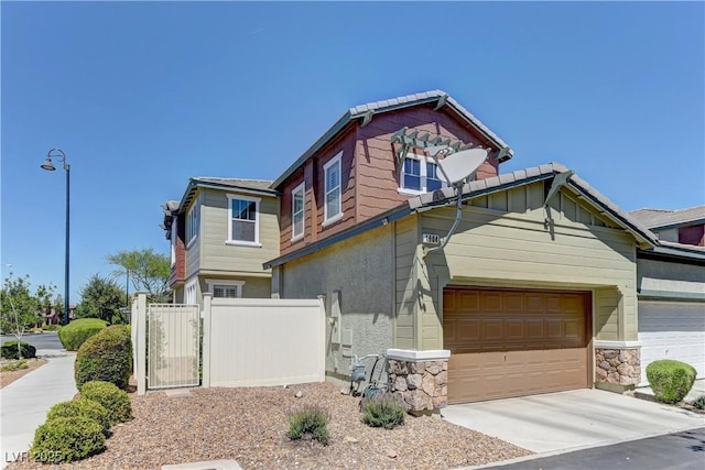 1904 Via Firenze, Henderson, NV 89044 - craftsman-style house with concrete driveway, stone siding, and an attached garage
