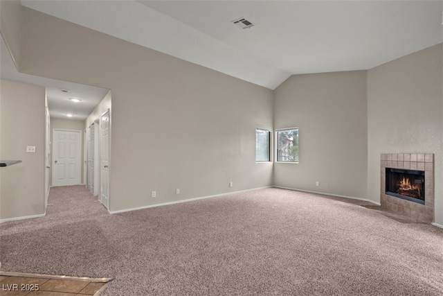 5042 S Rainbow Blvd Unit 206, Las Vegas, NV 89118 - unfurnished living room with carpet floors, vaulted ceiling, and a fireplace