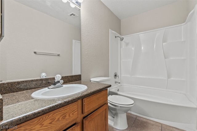 5042 S Rainbow Blvd Unit 206, Las Vegas, NV 89118 - bathroom with vanity, bathing tub / shower combination, tile patterned floors, and a textured wall
