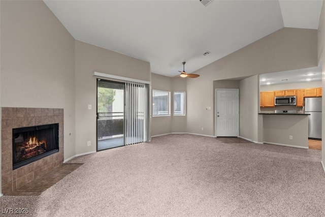 5042 S Rainbow Blvd Unit 206, Las Vegas, NV 89118 - unfurnished living room featuring carpet floors, a fireplace, high vaulted ceiling, and a ceiling fan