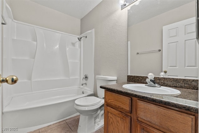 5042 S Rainbow Blvd Unit 206, Las Vegas, NV 89118 - bathroom with vanity, shower / tub combination, a textured wall, and tile patterned floors