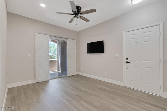 5751 E Hacienda Ave Unit 159, Las Vegas, NV 89122 - unfurnished living room featuring light wood finished floors and a ceiling fan