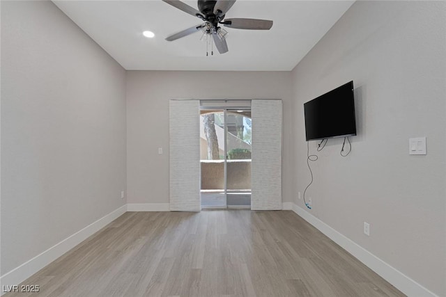 5751 E Hacienda Ave Unit 159, Las Vegas, NV 89122 - empty room with light wood-style floors and a ceiling fan