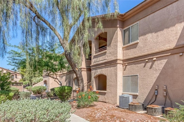 5751 E Hacienda Ave Unit 159, Las Vegas, NV 89122 - back of house featuring stucco siding