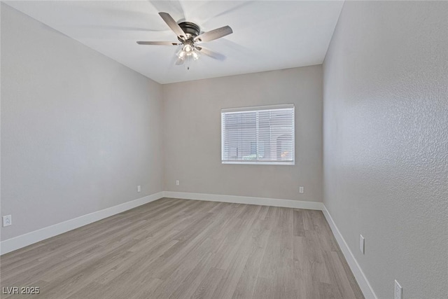 5751 E Hacienda Ave Unit 159, Las Vegas, NV 89122 - empty room featuring a ceiling fan and light wood-style flooring