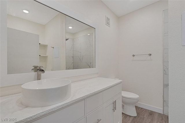 5751 E Hacienda Ave Unit 159, Las Vegas, NV 89122 - full bath featuring wood finished floors, vanity, a shower, and recessed lighting
