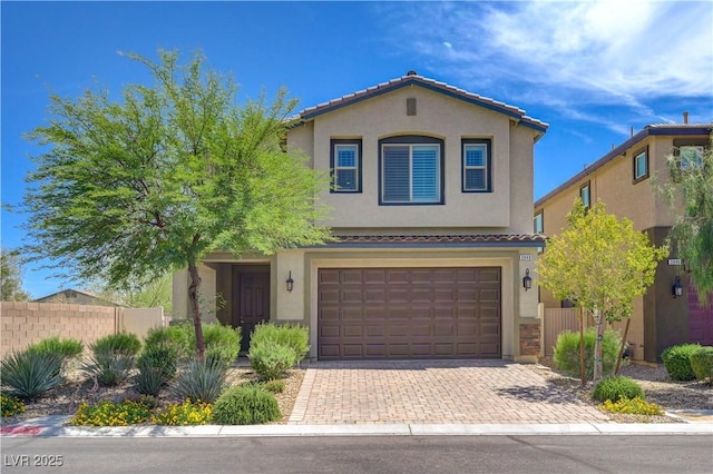 3949 Amanda Bay Ave, North Las Vegas, NV 89081 - view of front of house featuring stucco siding, a tile roof, an attached garage, and decorative driveway