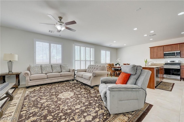 3949 Amanda Bay Ave, North Las Vegas, NV 89081 - living room with ceiling fan, recessed lighting, and light tile patterned floors