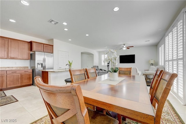 3949 Amanda Bay Ave, North Las Vegas, NV 89081 - dining room with arched walkways, light tile patterned flooring, ceiling fan, and recessed lighting