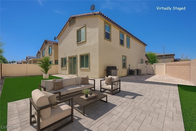 3949 Amanda Bay Ave, North Las Vegas, NV 89081 - rear view of house with stucco siding, a patio area, a fenced backyard, and an outdoor living space