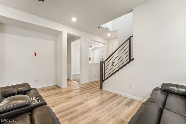 3641 Portici Ln, Henderson, NV 89044 - living area with light wood finished floors, stairway, recessed lighting, and ceiling fan