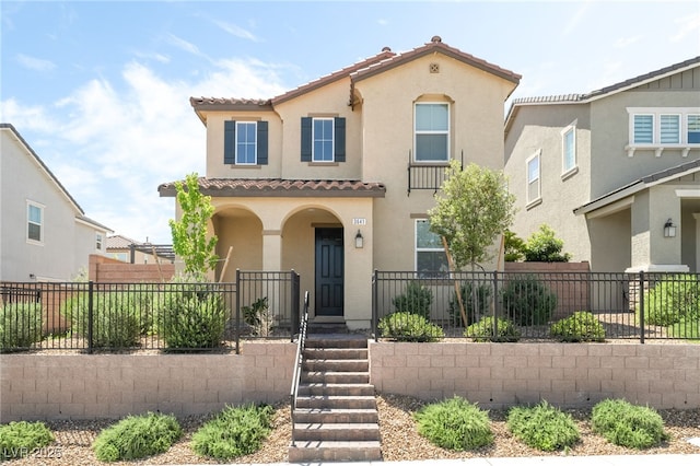 3641 Portici Ln, Henderson, NV 89044 - mediterranean / spanish-style house featuring a tile roof, stucco siding, and a porch