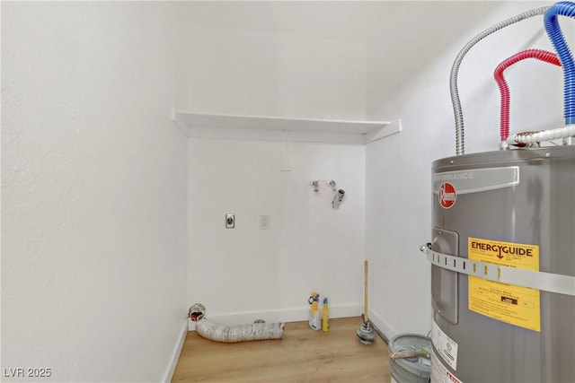 2963 Juniper Hills Blvd Unit 104, Las Vegas, NV 89142 - washroom featuring strapped water heater, wood finished floors, and electric dryer hookup