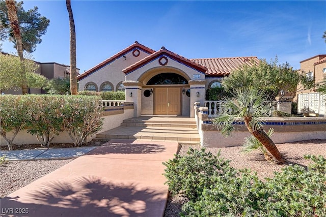 2963 Juniper Hills Blvd Unit 104, Las Vegas, NV 89142 - mediterranean / spanish-style house with stucco siding and a tiled roof