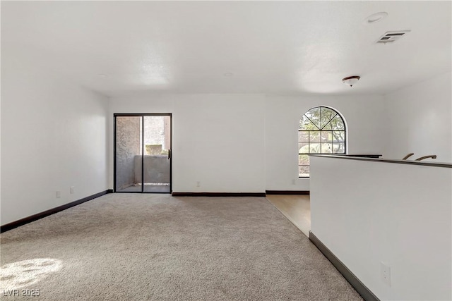 2963 Juniper Hills Blvd Unit 104, Las Vegas, NV 89142 - spare room featuring light colored carpet and healthy amount of natural light