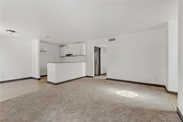 2963 Juniper Hills Blvd Unit 104, Las Vegas, NV 89142 - unfurnished living room with light carpet