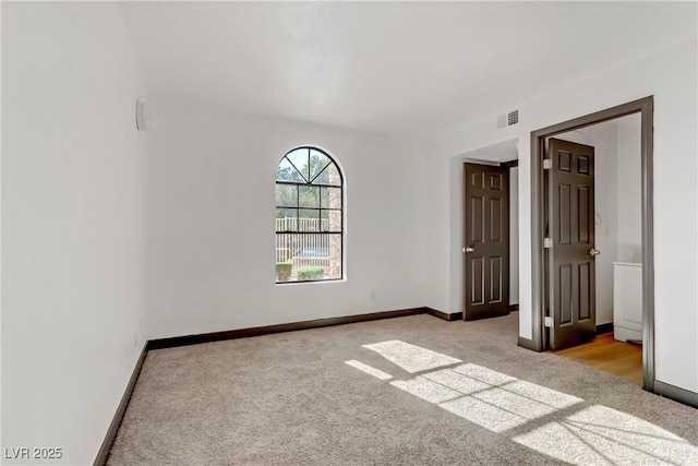2963 Juniper Hills Blvd Unit 104, Las Vegas, NV 89142 - unfurnished bedroom with light carpet and baseboards