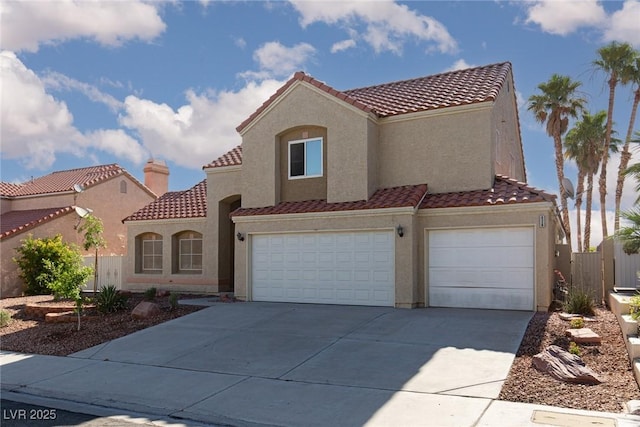 426 Lost Trail Dr, Henderson, NV 89014 - mediterranean / spanish home featuring a tiled roof, concrete driveway, stucco siding, and an attached garage