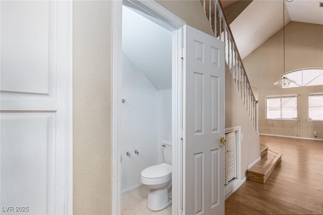 426 Lost Trail Dr, Henderson, NV 89014 - bathroom featuring lofted ceiling, a chandelier, and wood finished floors