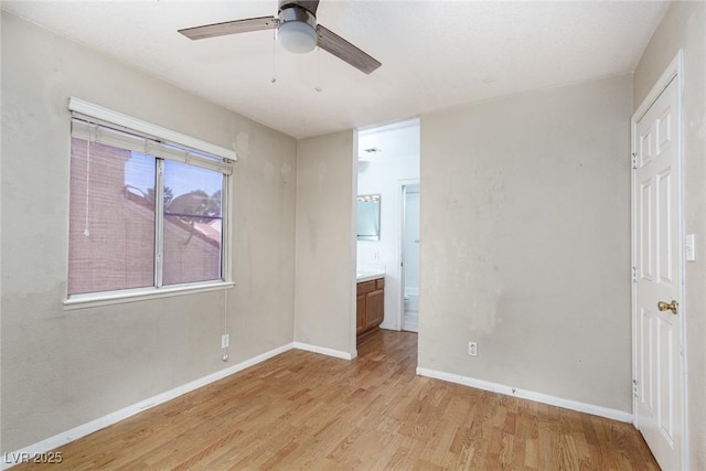 426 Lost Trail Dr, Henderson, NV 89014 - unfurnished bedroom with light wood-style flooring, ensuite bathroom, and a ceiling fan