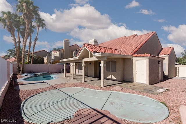 426 Lost Trail Dr, Henderson, NV 89014 - rear view of property with a tiled roof, a fenced backyard, a patio, and stucco siding