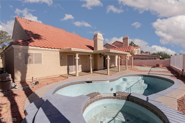 426 Lost Trail Dr, Henderson, NV 89014 - view of pool with a fenced backyard, a patio, a pool with connected hot tub, and ceiling fan
