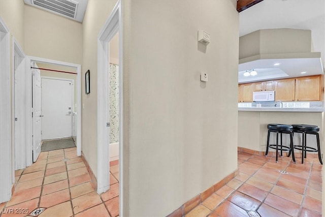 9517 Mountainair Ave, Las Vegas, NV 89134 - hallway with light tile patterned flooring and baseboards
