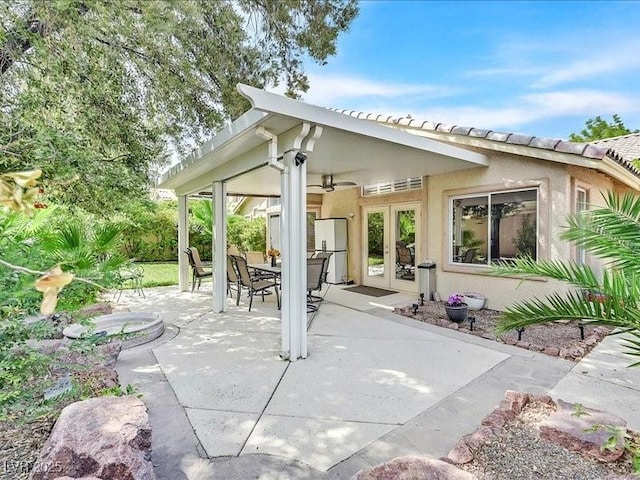 9517 Mountainair Ave, Las Vegas, NV 89134 - view of patio / terrace with ceiling fan, french doors, and outdoor dining space