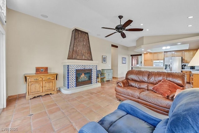 9517 Mountainair Ave, Las Vegas, NV 89134 - living area featuring a ceiling fan, a tile fireplace, recessed lighting, vaulted ceiling, and light tile patterned floors
