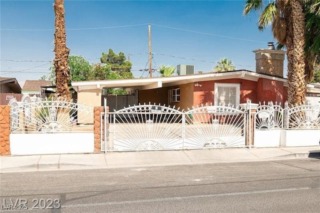 624 N Bruce St, Las Vegas, NV 89101 - view of front of house with a gate and stucco siding