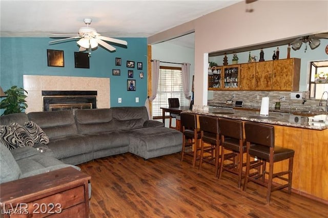 624 N Bruce St, Las Vegas, NV 89101 - living area featuring ceiling fan, wood finished floors, and a fireplace