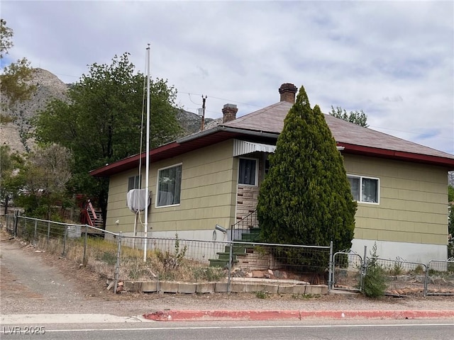 49 Fourth, Mcgill, NV 89318 - view of side of property featuring a chimney