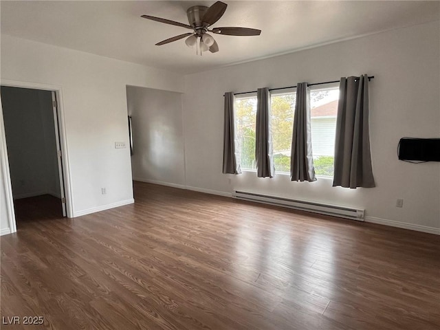 49 Fourth, Mcgill, NV 89318 - unfurnished room with a baseboard heating unit, ceiling fan, and dark wood finished floors