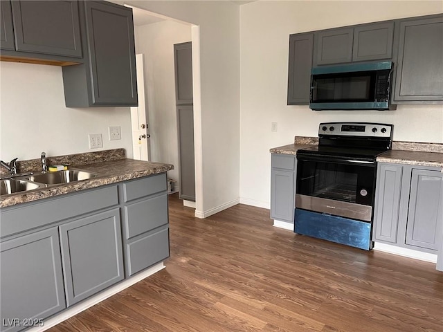 49 Fourth, Mcgill, NV 89318 - kitchen featuring stainless steel electric range, dark wood-style floors, gray cabinets, and dark countertops