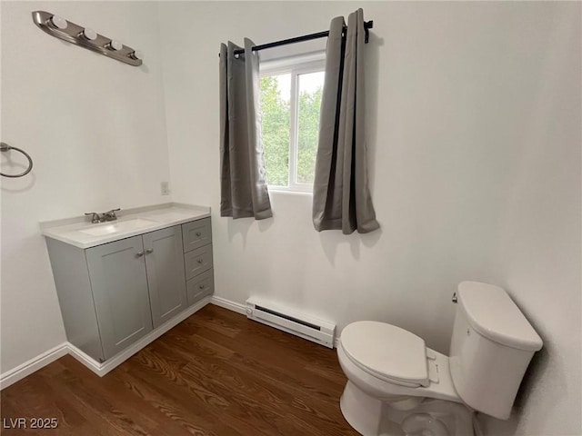 49 Fourth, Mcgill, NV 89318 - bathroom with baseboard heating, wood finished floors, and vanity